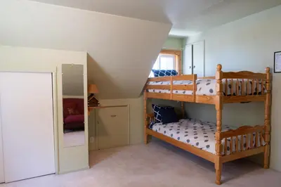 a bedroom with two bunk beds in a room at Fern Grove - Hot Tub, Pet Friendly, Walk to Lake! in Tahoe City