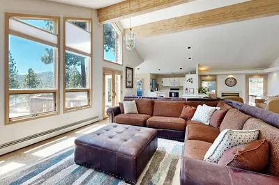 a large living room with a couch and a table at Livin' Lake Life in Incline Village