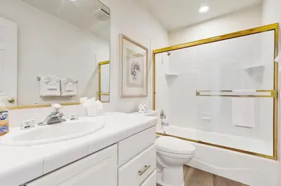 a bathroom with a sink and a toilet and a shower at Livin' Lake Life in Incline Village