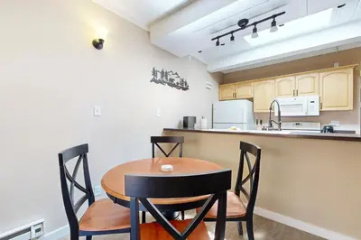 a kitchen with a wooden table and chairs at Alpine Serenity in Incline Village