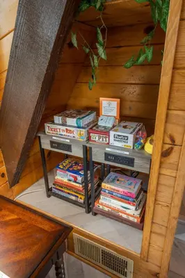 a stack of blankets on a shelf in a room at Quail Haven- A-frame cabin with hot tub, views, and more in Oakhurst