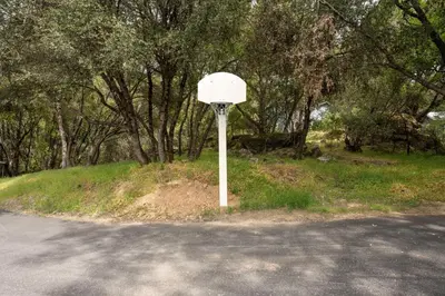 a basketball hoop on the side of a road at Quail Haven- A-frame cabin with hot tub, views, and more in Oakhurst