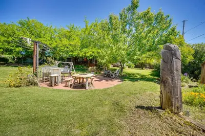 a garden with a picnic table and a playground at Auburn Cottage with Patios and Garden - 3 Mi to Town! in Auburn