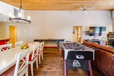 a kitchen and dining room with a gas stove in a room at Home with Deck and Access to Tahoe Donner Amenities! in Truckee