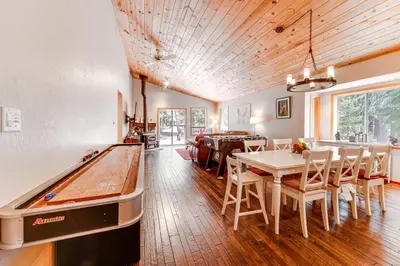 a room with a pool table and a dining room at Home with Deck and Access to Tahoe Donner Amenities! in Truckee