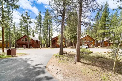 a driveway in front of a log cabin at Home with Deck and Access to Tahoe Donner Amenities! in Truckee