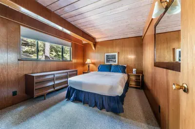 a bedroom with a large bed and a window at 4BR Tahoe Retreat in Prime Location in Tahoe City