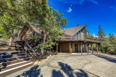 a log home with stairs leading up to it at 4BR Tahoe Retreat in Prime Location in Tahoe City