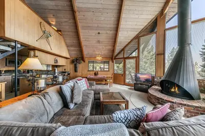 a living room with a couch and a fireplace at 4BR Tahoe Retreat in Prime Location in Tahoe City