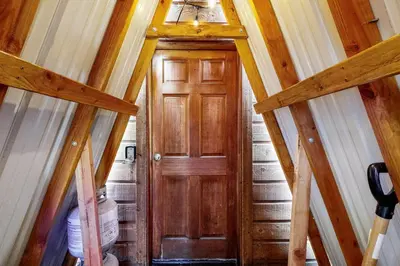 a hallway with a wooden door in a house at Forest View in Soda Springs