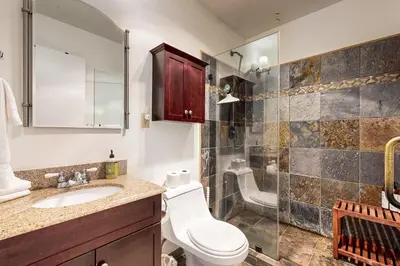 a bathroom with a toilet and a sink and a shower at Forest View in Soda Springs