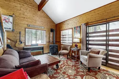 a living room with a couch and a table at Forest View in Soda Springs