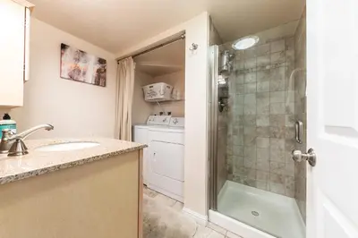 a small bathroom with a sink and a shower at 2BR Mins to Alpine Base Area Palisades! in Alpine Meadows