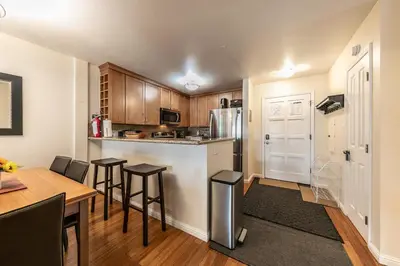 a kitchen with a counter and a table and chairs at 2BR Mins to Alpine Base Area Palisades! in Alpine Meadows