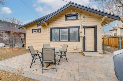 a table and chairs in front of a house at Walk to Midtown Charming Reno Retreat in Reno