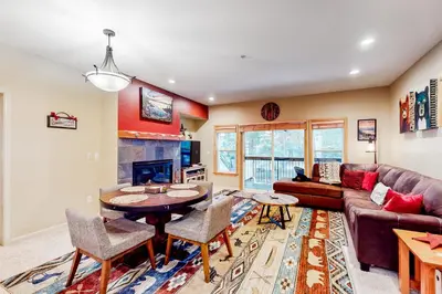 a living room with a couch and a table at Tavern Inn #38 in Olympic Valley