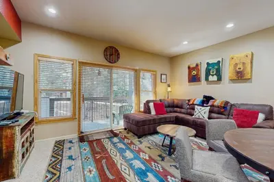 a living room with a couch and a table at Tavern Inn #38 in Olympic Valley