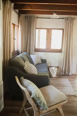 a living room with a couch and a window at Redwood Grove in Sequoia and Kings Canyon National Park in Wilsonia