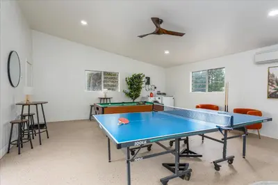 a room with a ping pong table in it at Vista Haven with stunning views/hot tub/mini golf in Oakhurst