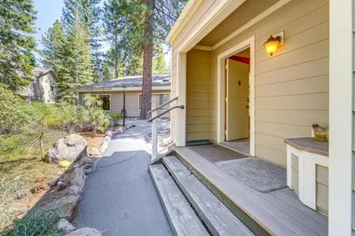 a porch of a house with a yellow door at 2 Mi to Beach Inviting Incline Village Escape in Incline Village