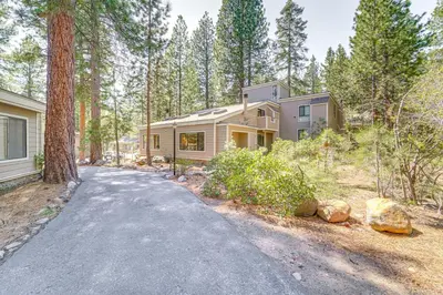 a house in the woods with a driveway at 2 Mi to Beach Inviting Incline Village Escape in Incline Village
