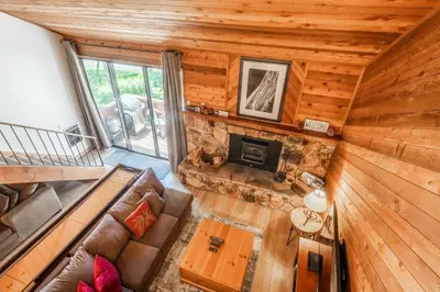 an overhead view of a living room in a log cabin at Snowflower #79 - Updated 2 Bedroom & Loft, 3 Bath, Sleeps 8, Steps away from Free Town Shuttle in Mammoth Lakes