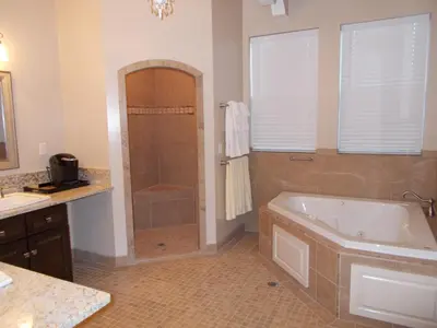a large bathroom with a tub and a shower at The Inn at 161 in Sutter Creek