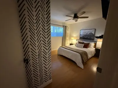 a bedroom with a bed and a ceiling fan at Home in the Pines - Apple Hill - Dog Friendly - Snow Nearby in Pollock Pines