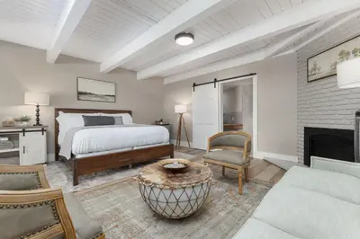 a bedroom with a bed and a fireplace at Big Pine Suite CN Lodge R#1 in Ponderosa