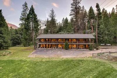 a large house in the middle of a field at Timberline Retreat CN Lodge #3 in Ponderosa