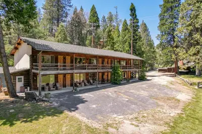 a large house with a lot of windows at Mountain Nook CN Lodge #4 in Ponderosa