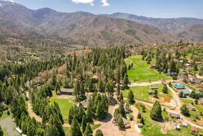 an aerial view of a park with trees and mountains at Sierra Vista @CN Lodge #8 in Ponderosa