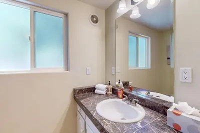 a bathroom with a sink and a mirror at Summit Sanctuary in Stateline