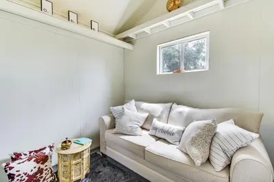 a living room with a couch and a window at Yosemite Wellbeing Retreat on 5 Acres with Mtn Views in Ahwahnee