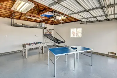 a ping pong room with two ping pong tables at Mid Century Wineries Game Room in Lodi