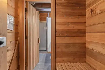 a room with wood paneling and a hallway at 3BR with Sauna & Lake Views, 2 miles to Beach in Tahoe City