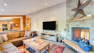 a living room with a couch and a fireplace at Paige Meadow by AvantStay Near Lake Tahoe City in Tahoe City