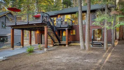 a house with a staircase leading up to a house at Paige Meadow by AvantStay Near Lake Tahoe City in Tahoe City