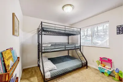 a bedroom with two bunk beds in a room at Fire Pit, Near Lake Evergreen Escape in Arnold in Arnold
