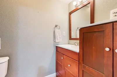 a bathroom with a sink and a mirror at Fire Pit, Near Lake Evergreen Escape in Arnold in Arnold