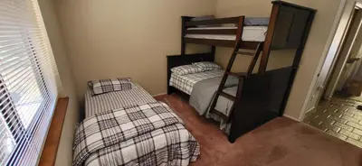 a bedroom with two beds and a bunk bed at Starlink Mariposa Yosemite mountain retreat in Mariposa