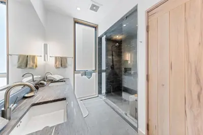 a bathroom with a sink and a shower at Elevation Ski-in, Ski-out in Northstar w Private Hot Tub & HOA Amenities in Truckee