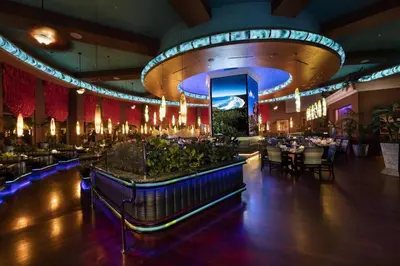a dining room with tables and chairs in a restaurant at Peppermill Resort Spa Casino in Reno
