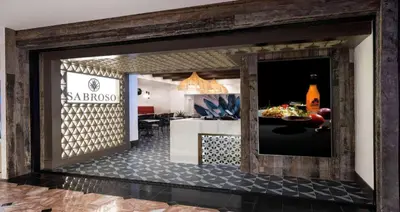 a room with a kitchen and a dining room at Peppermill Resort Spa Casino in Reno