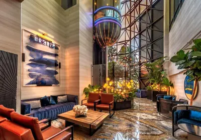 a lobby with couches and tables in a building at Atlantis Casino Resort Spa in Reno