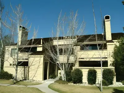 a large building with two chimneys on top of it at Club Lakeridge Resort in Reno