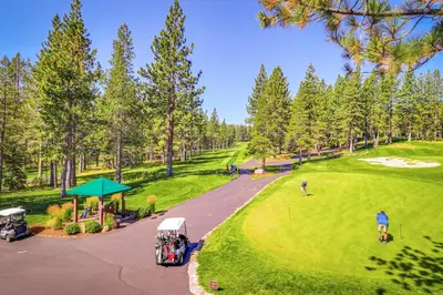 an aerial view of a golf course with people playing golf at Pine in the Sky in Truckee