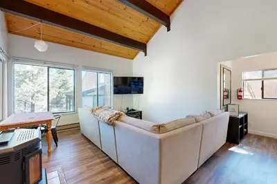 a living room with a couch and a table at Pine in the Sky in Truckee