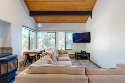 a living room with a couch and a table at Pine in the Sky in Truckee