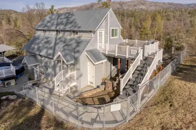 an aerial view of a house behind a fence at Mountain View Apartment in North Fork